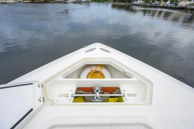 Slide: The Image of Bow storage compartment of a 2016 SeaVee 390Z boat with rope and life preserver. - 2