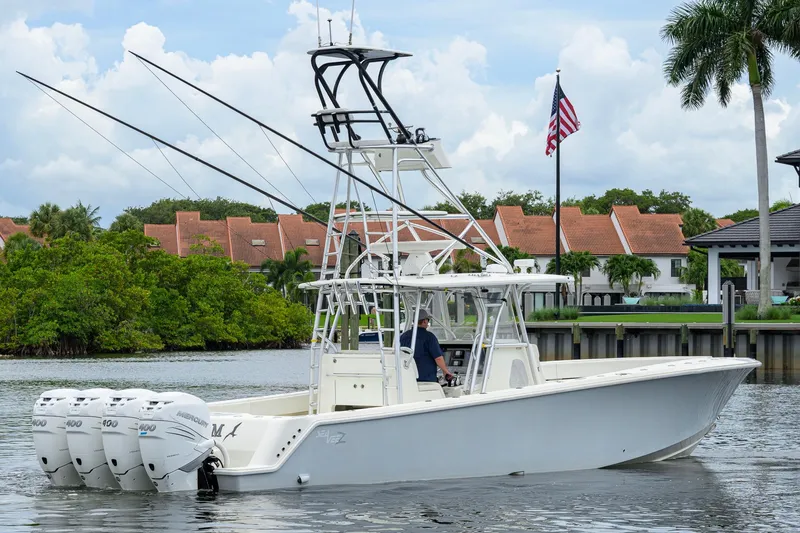 Slide: The Image of 2016 SeaVee 390Z boat with quad engines on a scenic waterway. - 68