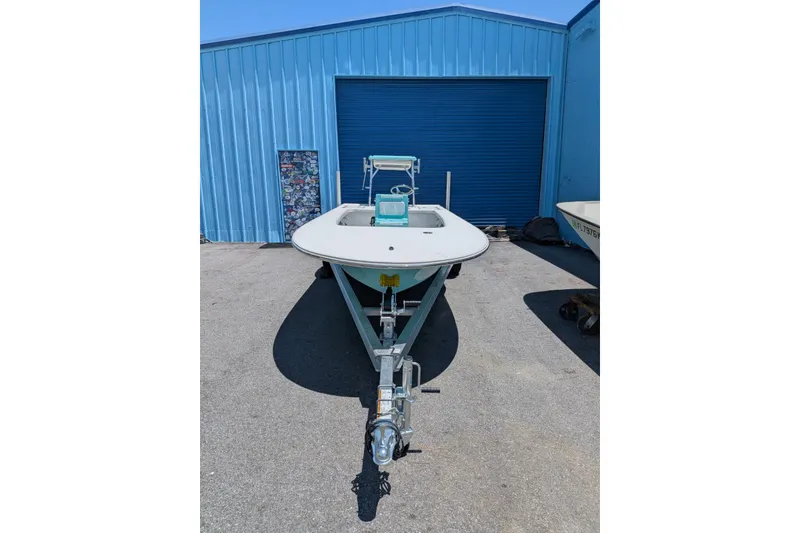 Slide: The Image of 2026 Mitzi Skiffs 17 Tournament boat parked outside blue warehouse. - 3
