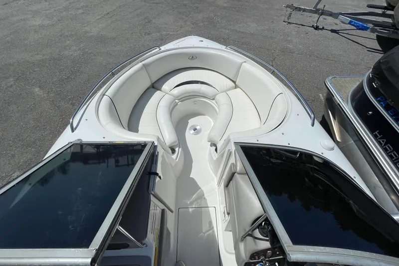Slide: The Image of 2005 Ebbtide 2200 Bow Rider boat with spacious seating and sleek design. - 10