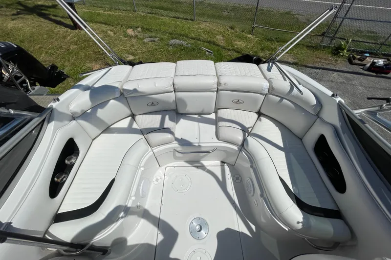 Slide: The Image of 2005 Ebbtide 2200 Bow Rider boat with spacious white seating area. - 5