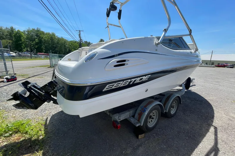 Slide: The Image of 2005 Ebbtide 2200 Bow Rider boat on trailer, parked outdoors. - 9