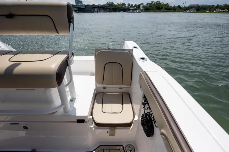 Slide: The Image of 2023 Yamaha Boats 222 FSH Sport E interior seating with water view. - 9