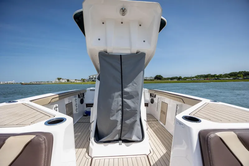 Slide: The Image of 2023 Yamaha Boats 222 FSH Sport E, open deck view, on calm water. - 19