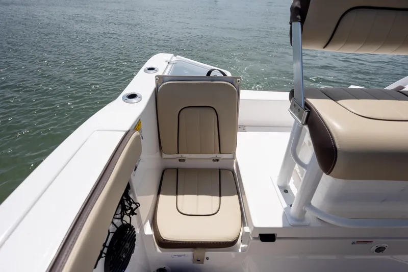 Slide: The Image of 2023 Yamaha Boats 222 FSH Sport E interior seating detail on water. - 10