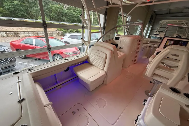 Slide: The Image of Interior of a 2026 Grady-White Freedom 235 boat, featuring luxurious seating and modern design. - 8