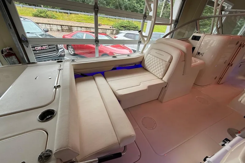Slide: The Image of 2026 Grady-White Freedom 235 boat interior with luxurious seating and modern design. - 23