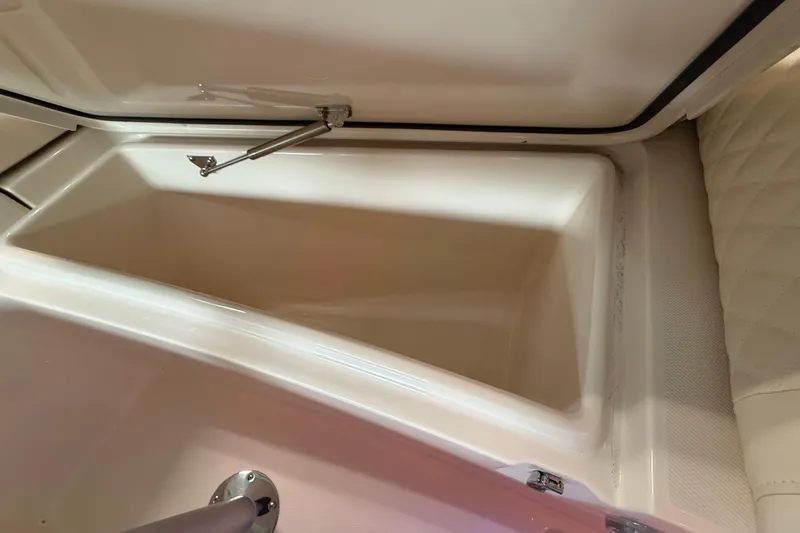 Slide: The Image of Open storage compartment in 2026 Grady-White Freedom 235 boat interior. - 26