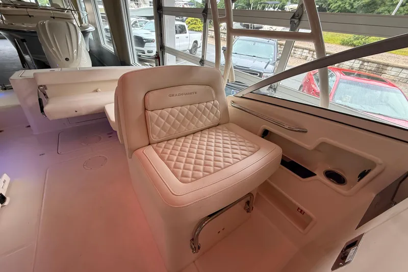 Slide: The Image of 2026 Grady-White Freedom 235 boat interior with luxurious seating and modern design. - 24