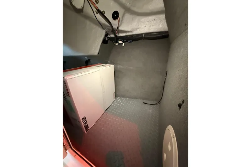 Slide: The Image of Interior cabin of 2026 Grady-White Freedom 235 boat with Yamaha box. - 27