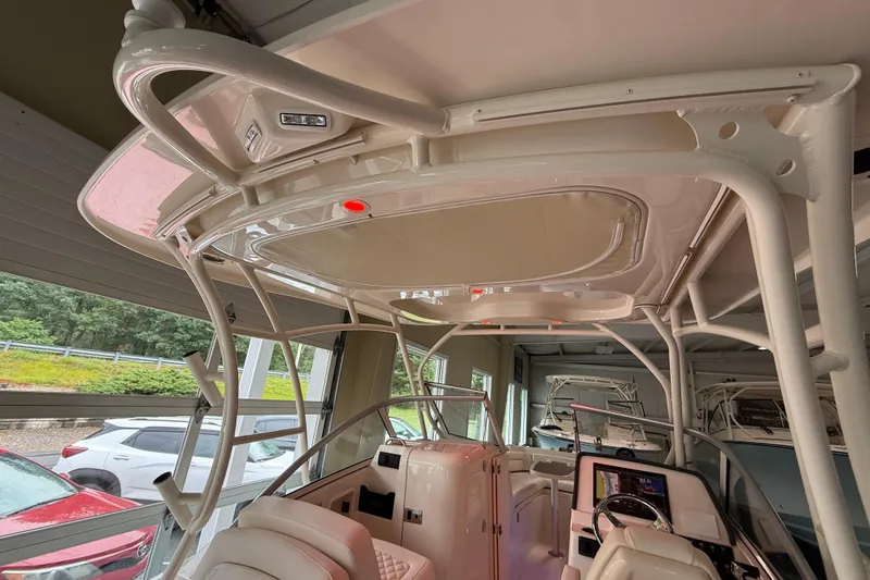 Slide: The Image of 2026 Grady-White Freedom 235 boat interior with helm and seating area. - 37