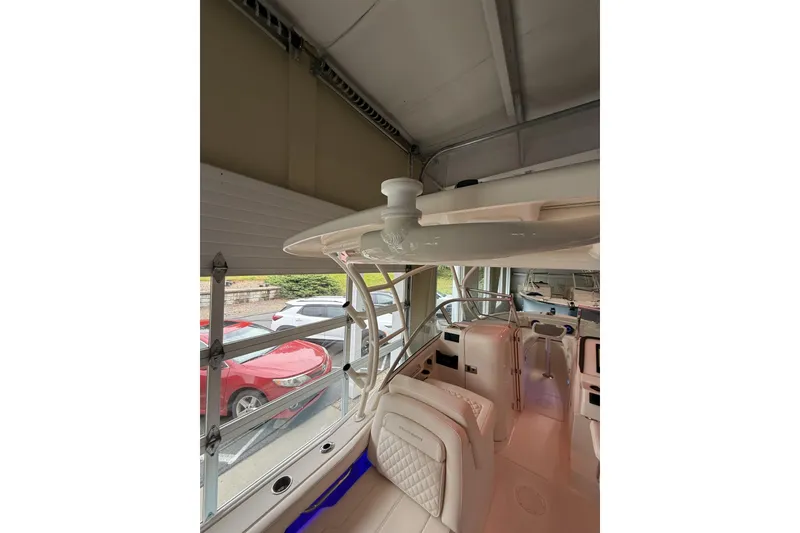 Slide: The Image of Interior view of 2026 Grady-White Freedom 235 boat, showcasing seating and helm area. - 42
