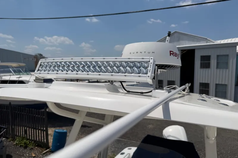 Slide: The Image of 2015 Regulator 23 Center Console with radar and LED light bar on roof. - 25