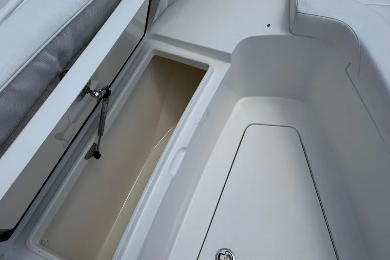 Slide: The Image of 2015 Regulator 23 Center Console boat storage compartment, open and empty. - 33