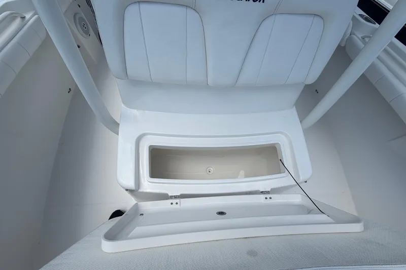Slide: The Image of 2015 Regulator 23 Center Console boat with open storage compartment. - 27