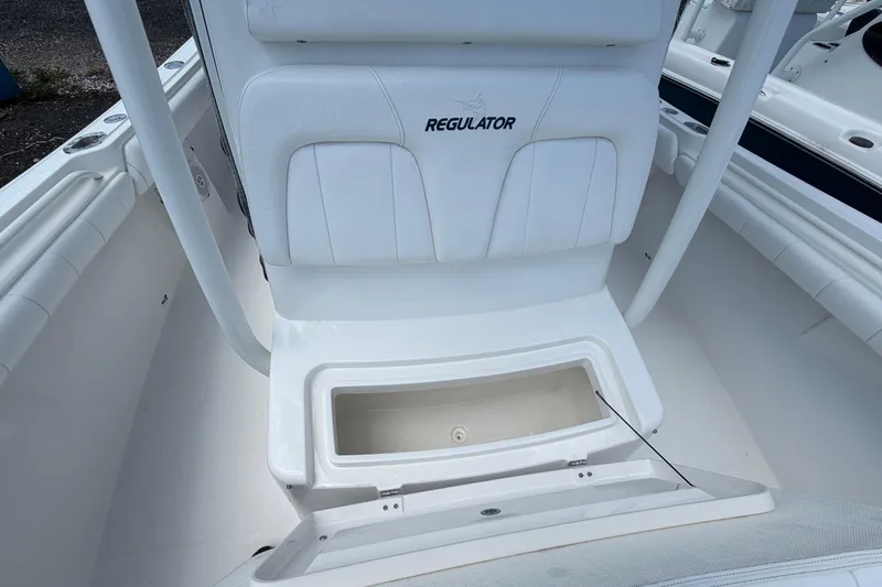 Slide: The Image of 2015 Regulator 23 Center Console boat with open storage compartment. - 32