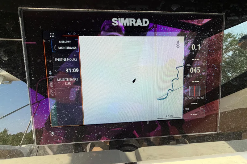 Slide: The Image of Simrad navigation display on 2024 Sea Ray SPX 190 Outboard showing engine hours and route. - 21