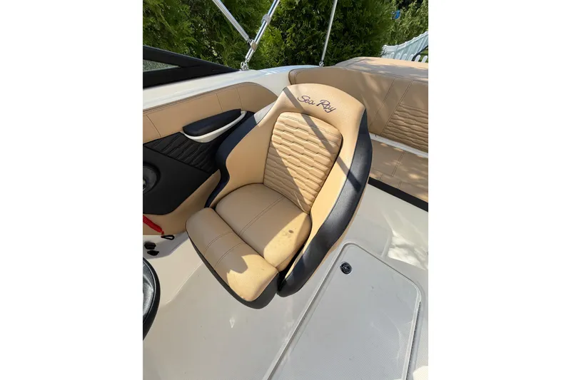 Slide: The Image of 2024 Sea Ray SPX 190 Outboard boat seat, tan and black upholstery, luxurious design. - 14