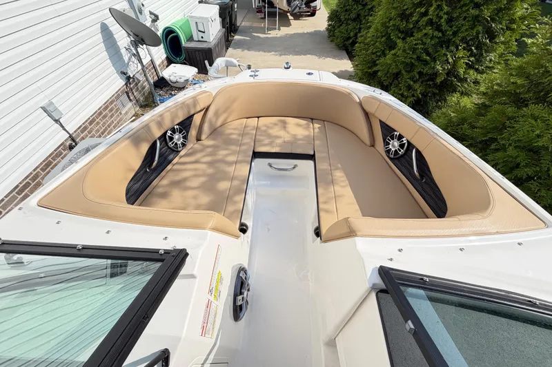 Slide: The Image of 2024 Sea Ray SPX 190 Outboard boat interior with tan seating and modern design. - 6