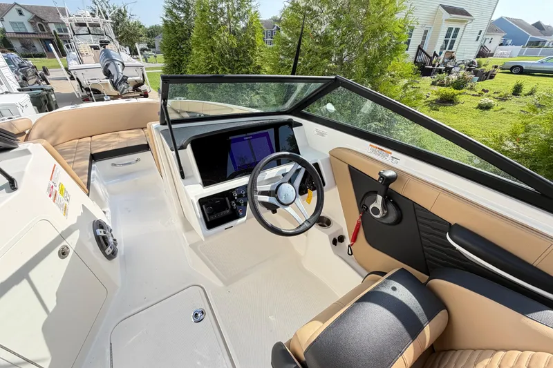Slide: The Image of 2024 Sea Ray SPX 190 Outboard boat interior with modern dashboard and seating. - 18