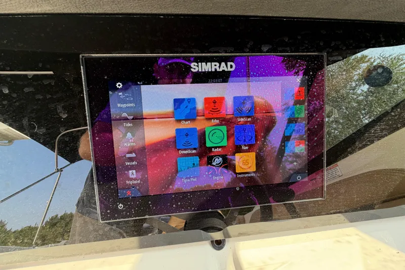 Slide: The Image of Simrad navigation display on 2024 Sea Ray SPX 190 Outboard boat dashboard. - 23