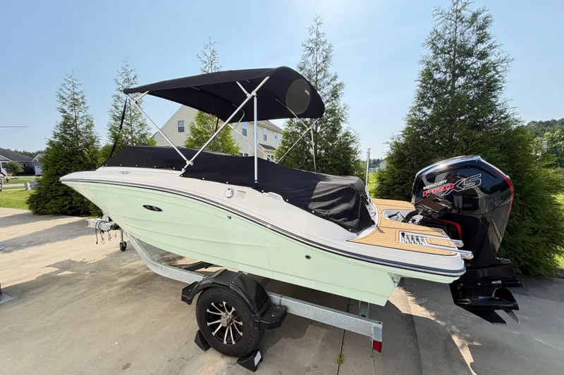 Slide: The Image of 2024 Sea Ray SPX 190 Outboard boat with cover and Mercury Pro XS engine. - 2