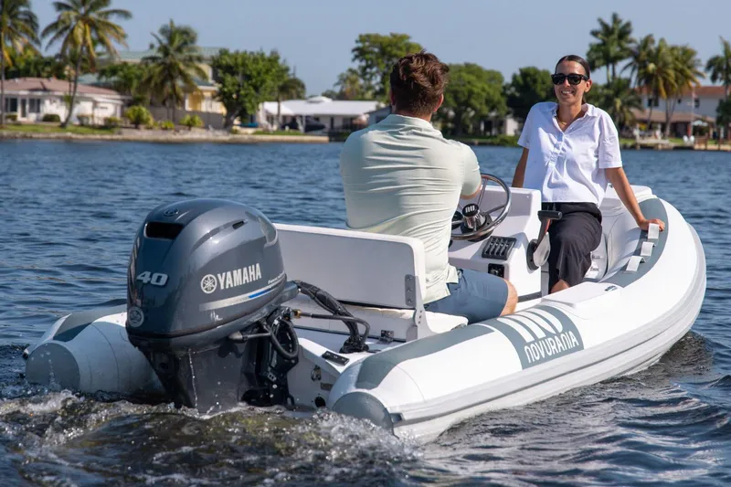 Slide: The Image of Manufacturer Provided Image: Novurania DL 360 boat 2026 on water with two people. - 5