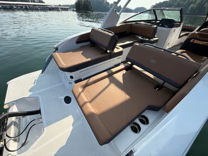 Slide: The Image of The image shows the stern of a 2023 Cobalt R6 Outboard boat with brown upholstery. - 17