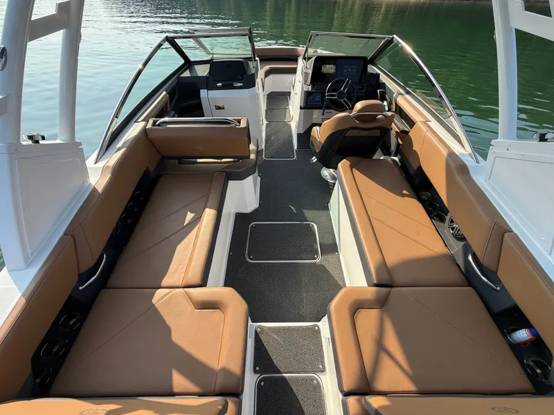 Slide: The Image of The image shows the interior of a 2023 Cobalt R6 Outboard with brown leather seats and a modern cockpit. - 19