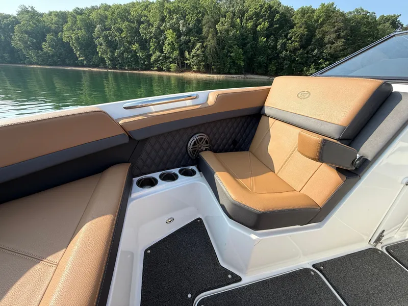 Slide: The Image of The image shows the interior of a 2023 Cobalt R6 Outboard with brown leather seating. - 37