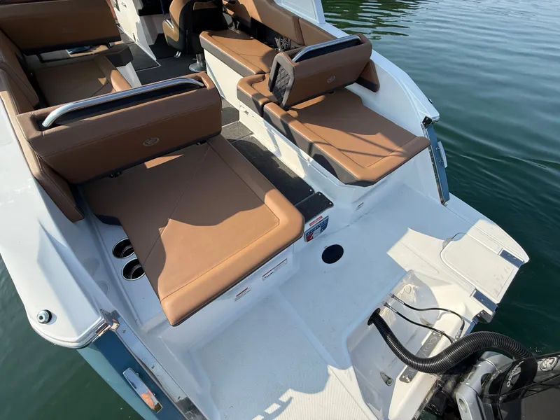 Slide: The Image of The image shows the stern of a 2023 Cobalt R6 Outboard boat with brown seating. - 15