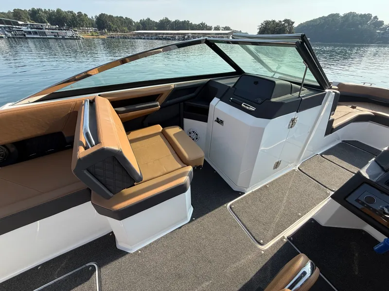 Slide: The Image of The image shows the cockpit of a 2023 Cobalt R6 Outboard with brown seating and a modern helm. - 40