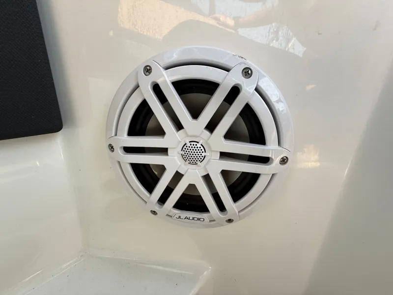 Slide: The Image of A white speaker is mounted on the wall of a boat. - 30