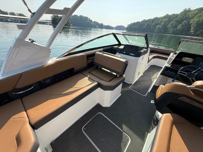 Slide: The Image of The image shows the interior of a 2023 Cobalt R6 Outboard with brown seating and a modern helm. - 22