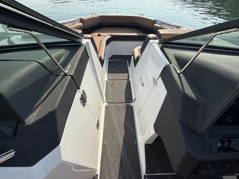 Slide: The Image of The image shows the cockpit of a 2023 Cobalt R6 Outboard boat with sleek seating and modern fixtures. - 32