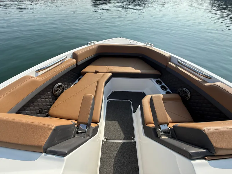 Slide: The Image of The image shows the bow of a 2023 Cobalt R6 Outboard boat with luxurious seating. - 35