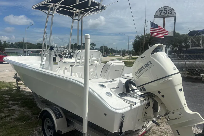 Slide: The Image of 2020 Glasstream 20 CCR boat with Suzuki outboard motor, parked outdoors. - 8