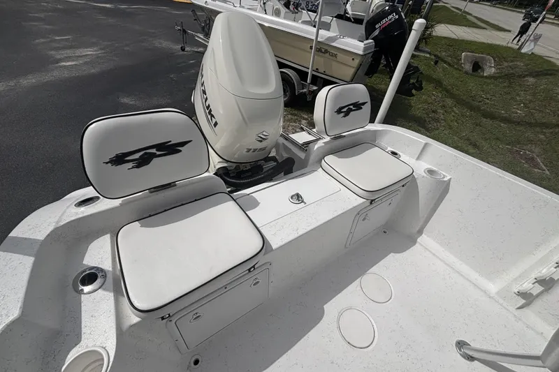 Slide: The Image of 2020 Glasstream 20 CCR boat with Suzuki engine, featuring dual cushioned seats and storage compartments. - 19