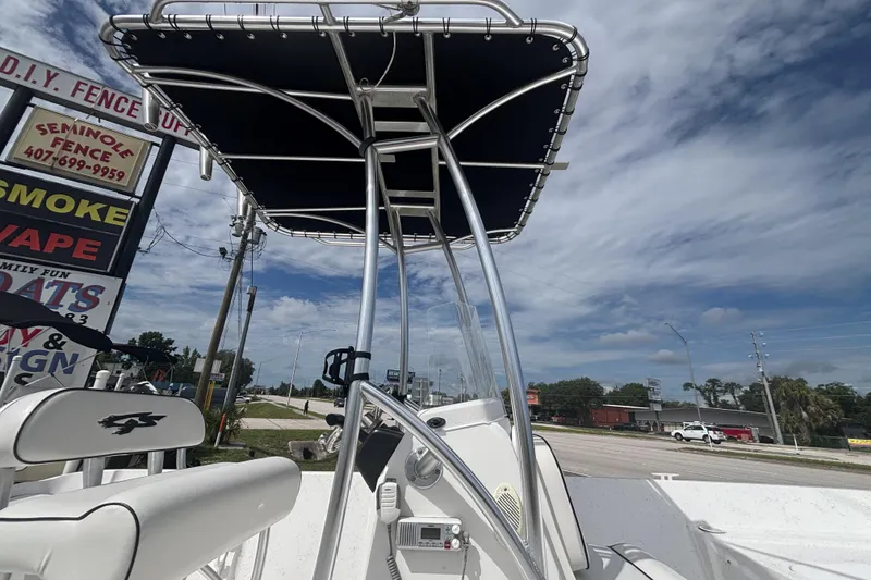 Slide: The Image of 2020 Glasstream 20 CCR boat with T-top, parked near roadside signs. - 14