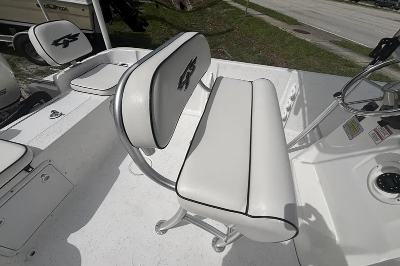 Slide: The Image of 2020 Glasstream 20 CCR boat interior with white seating and steering console. - 20
