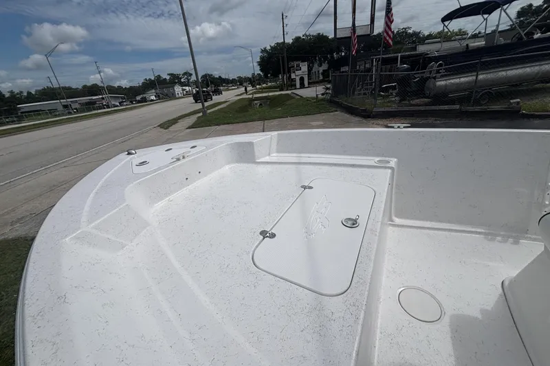 Slide: The Image of 2020 Glasstream 20 CCR boat deck with storage compartment, parked near a road. - 25