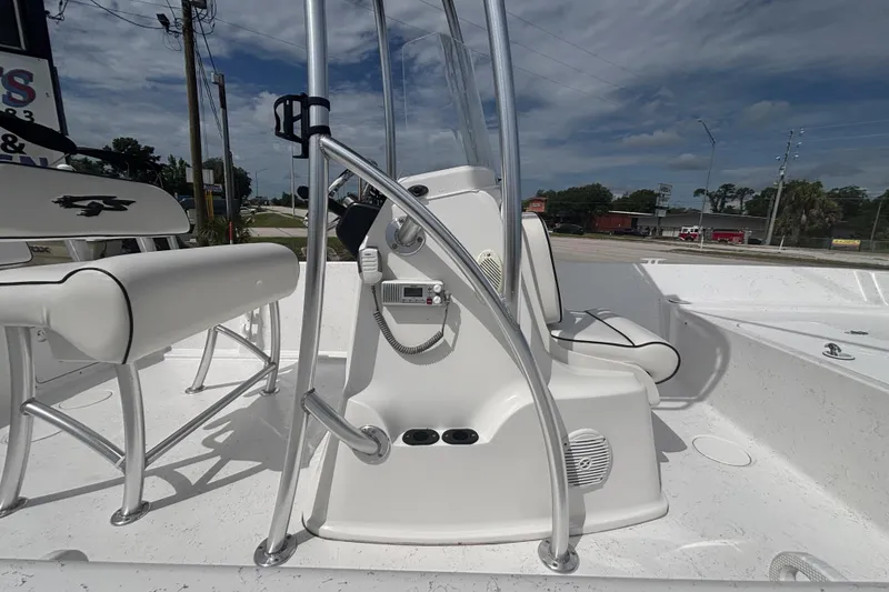 Slide: The Image of 2020 Glasstream 20 CCR boat interior with steering console and seating, under a clear blue sky. - 13