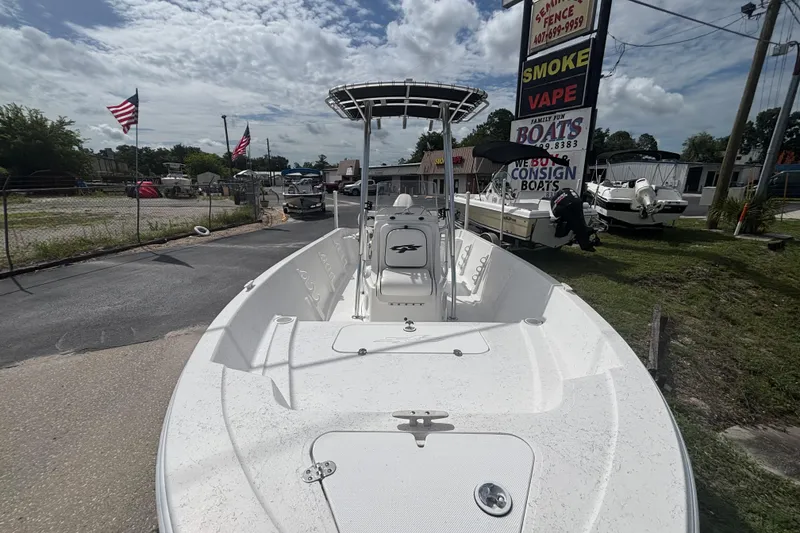 Slide: The Image of 2020 Glasstream 20 CCR boat displayed outdoors with American flags and signage. - 11
