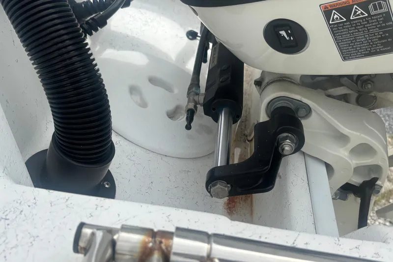 Slide: The Image of Close-up of 2020 Glasstream 20 CCR boat engine components and warning label. - 30