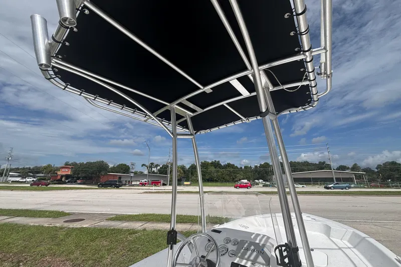 Slide: The Image of 2020 Glasstream 20 CCR boat with T-top, parked near a road under a blue sky. - 18