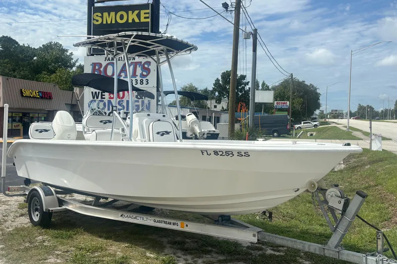 Slide: The Image of 2020 Glasstream 20 CCR boat on trailer, displayed outside a boat dealership. - 1