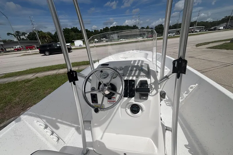 Slide: The Image of 2020 Glasstream 20 CCR boat dashboard with steering wheel and Garmin navigation system. - 21