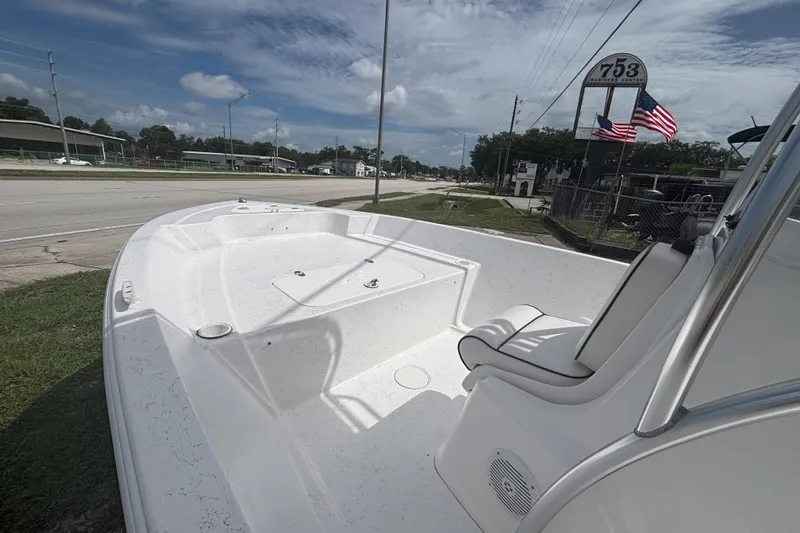 Slide: The Image of 2020 Glasstream 20 CCR boat with seating, parked near a road under a cloudy sky. - 9
