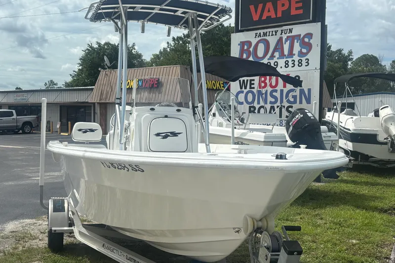 Slide: The Image of 2020 Glasstream 20 CCR boat on trailer at dealership, sign in background. - 2