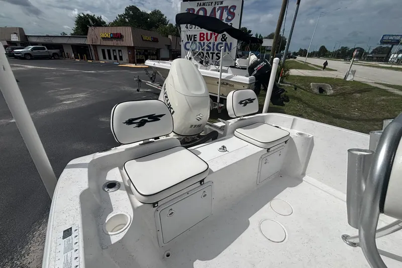 Slide: The Image of 2020 Glasstream 20 CCR boat with Suzuki engine, parked near a store. - 16
